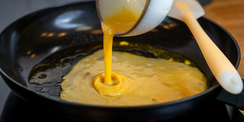 Pour The Whisked Eggs Into The Pan.