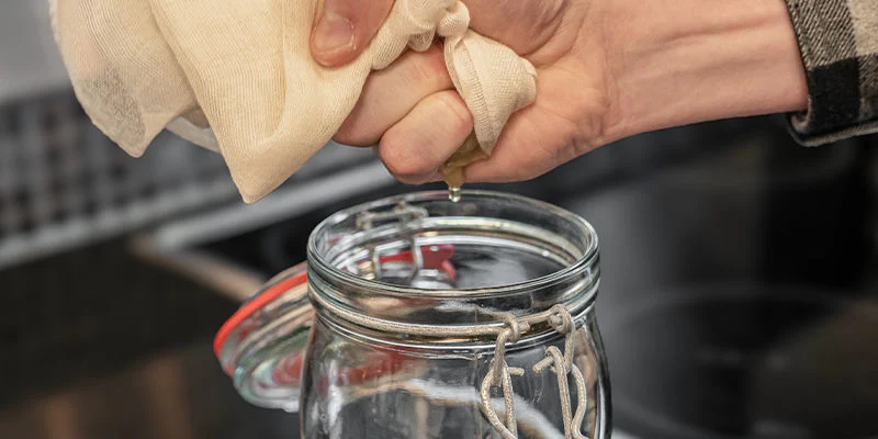 Pour the filtered syrup into a clean bottle or jar.