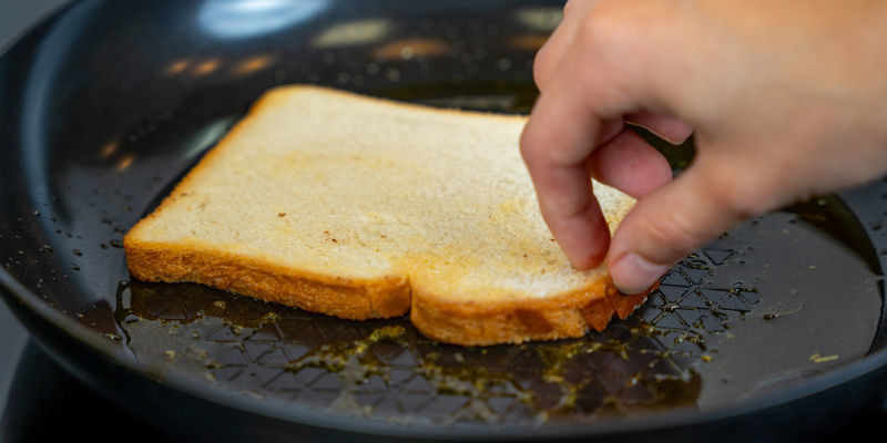 Place The Coated Bread Slices In The Frying Pan And Cook Until Golden Brown On Both Sides.